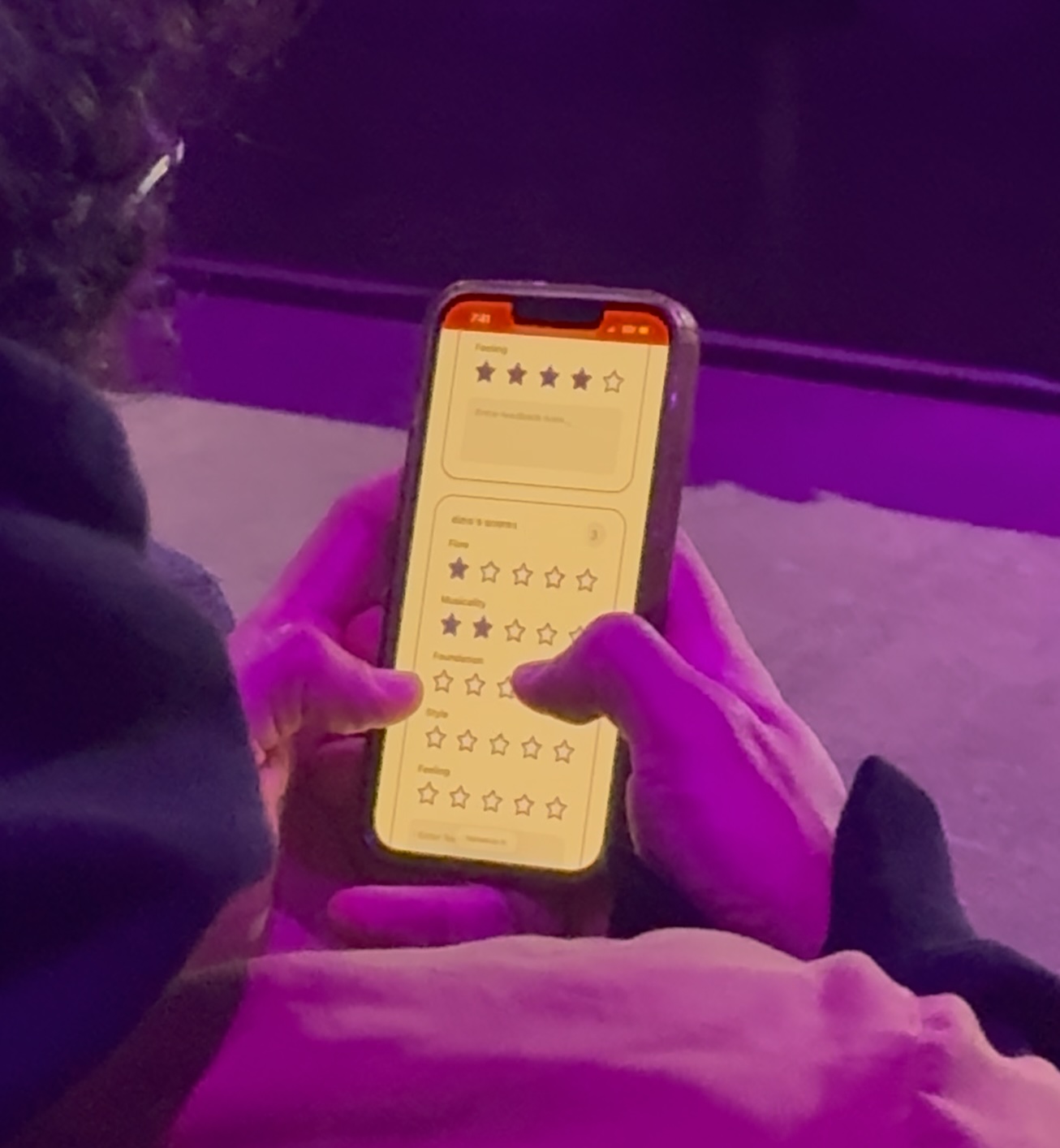 Judge scoring in real-time on their phone at a live event